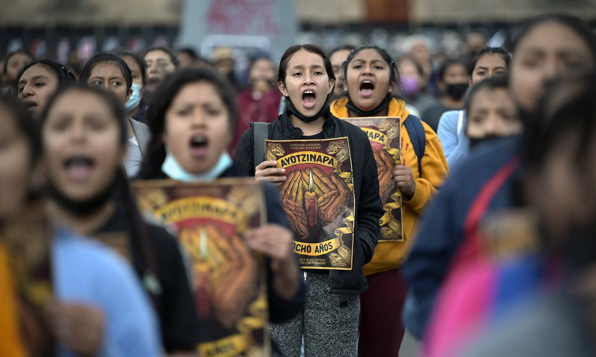 Thousands march to demand justice for Mexico’s missing students