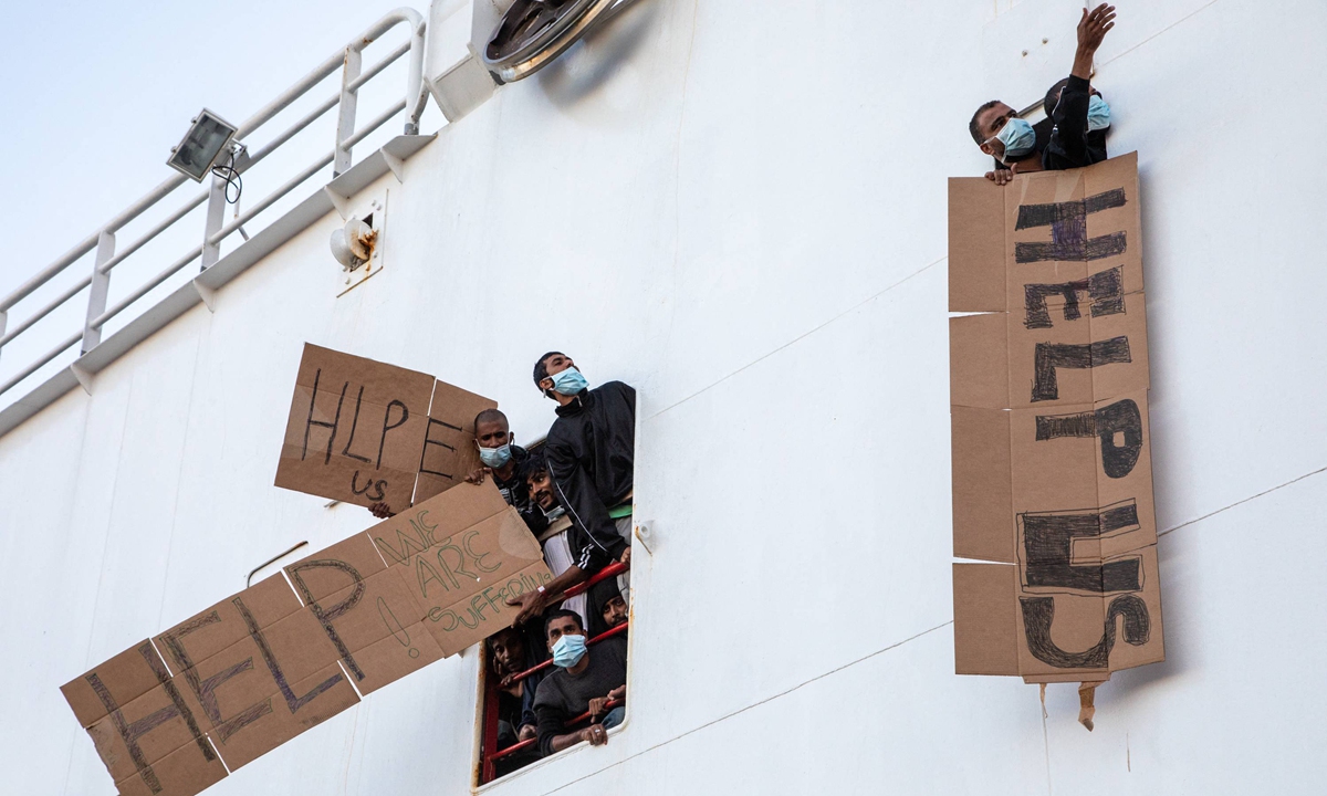 Italy lets in migrants from German boat, while other ships still waiting