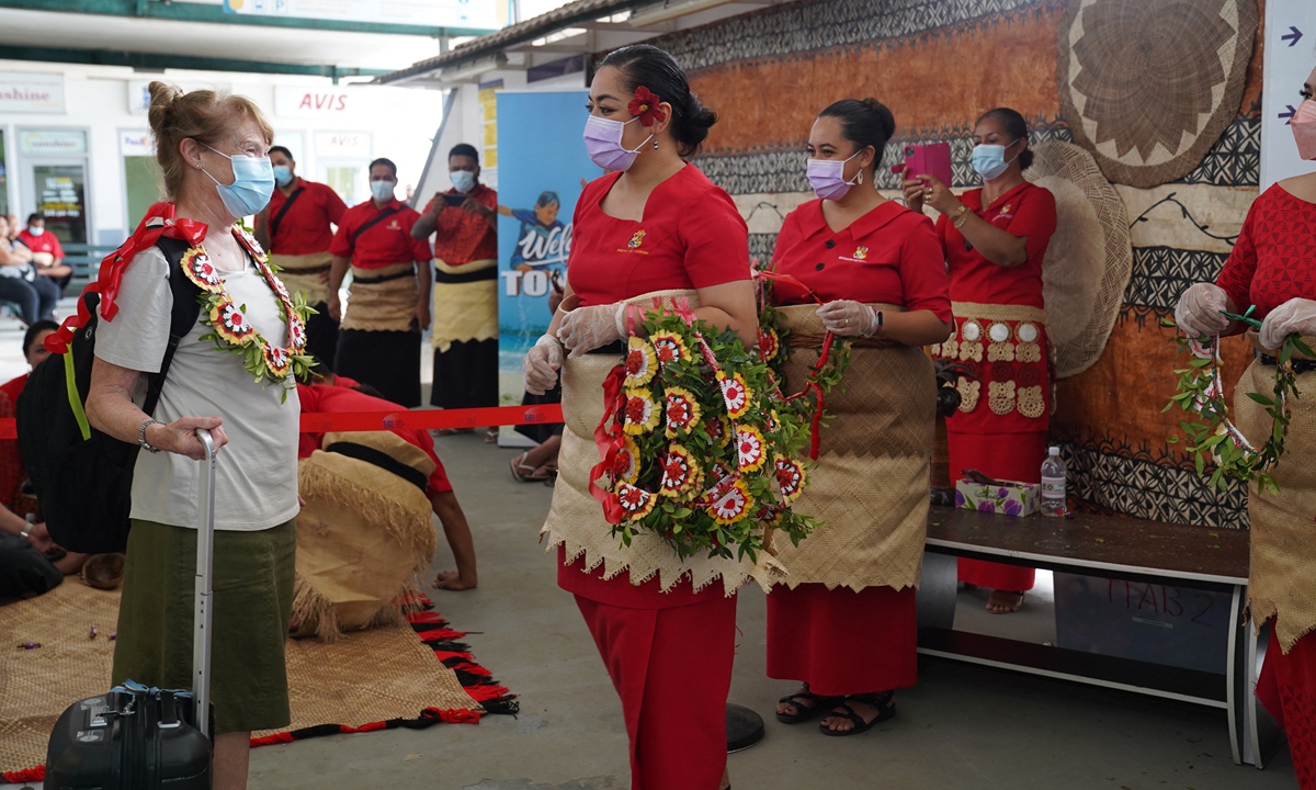 ‘Good to be back’: hugs and tears as Tonga reopens borders after it lifts restrictions