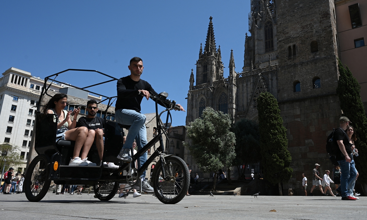 Mass tourism returns to Barcelona – so does debate