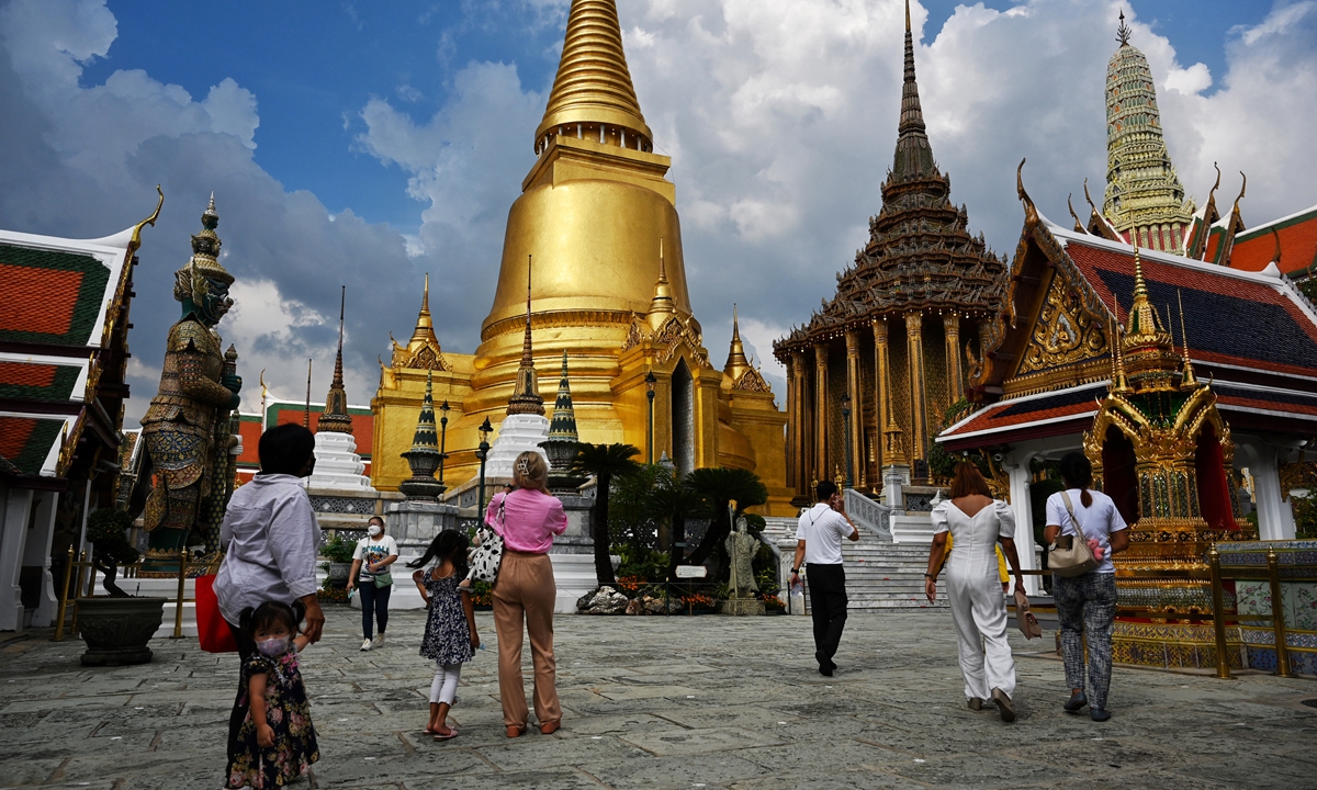 Hopes high as tourists touch down for Thailand reopening